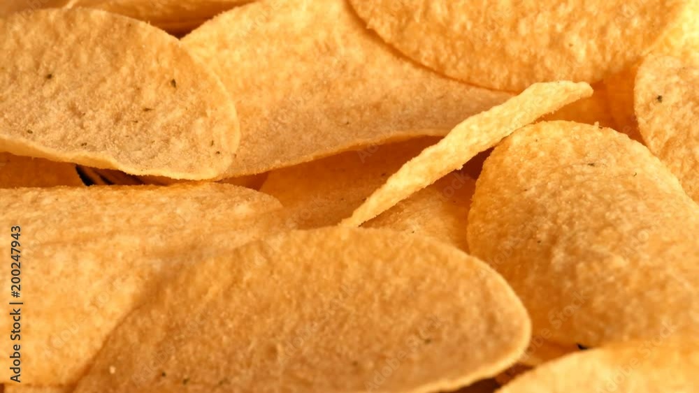 UHD of classic potato chips on the rotating stand UHD of classic potato chips on the rotating stand