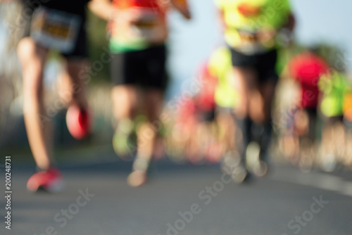 Marathon running in the light of evening,blurred abstract motion group of of running athletes
