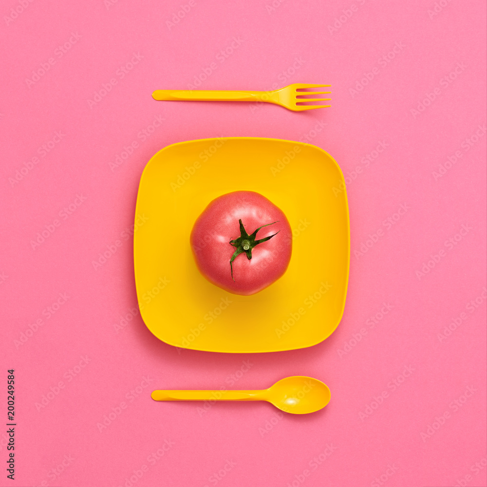 Fototapeta Tomato Fresh on plate. Food Organic Vegan Concept. Colorfull Vegetables. Flat lay. Trendy fashion Style. Minimal Design Art. Hot Summer Vibes. Bright Pink Yellow Color.