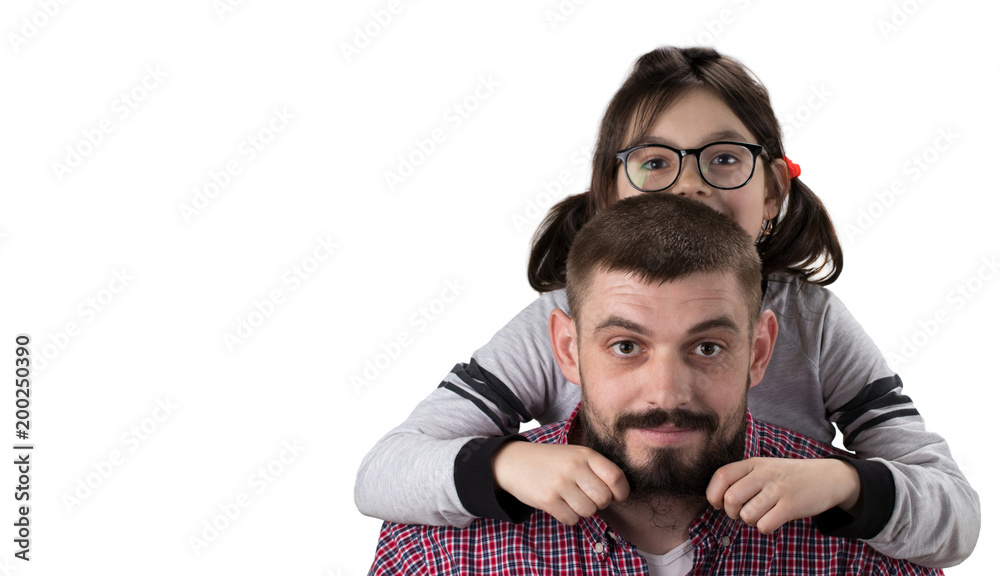 Portrait of handsome father and his cute daughter hugging, looking at camera and smiling Portrait of handsome father and his cute daughter hugging, looking at camera and smiling