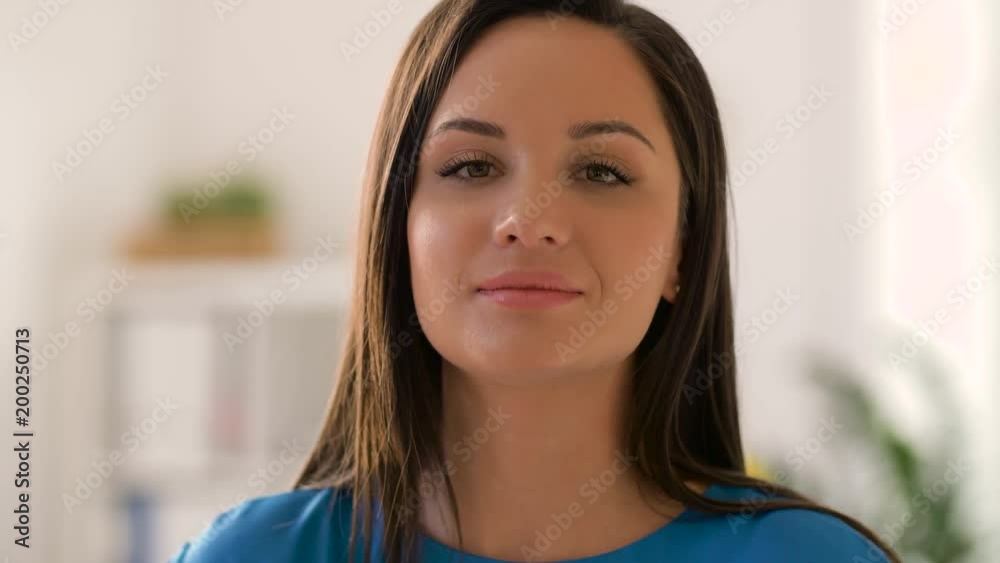 people concept - portrait of happy young woman adjusting her hair people concept - portrait of happy young woman adjusting her hair