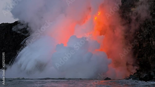 Lava from the Kīlauea volcano flows into the ocean on the Big Island of Hawaii photo