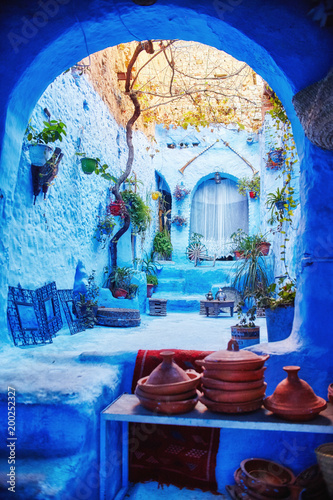 Morocco is the blue city of Chefchaouen, endless streets painted in blue color. Lots of flowers and Souvenirs in the beautiful streets of Chefchaouen. A magical fairy-tale city of heavenly color © Mars0hod