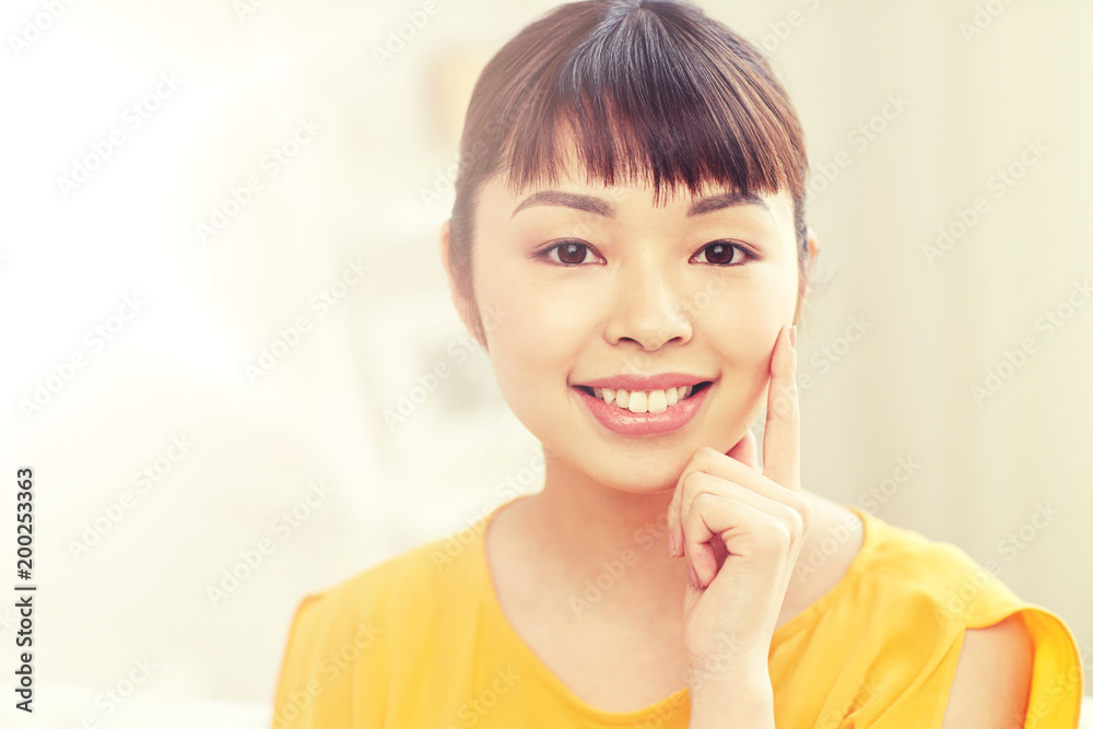 people, race, ethnicity and portrait concept - happy asian young woman or teenage girl face at home people, race, ethnicity and portrait concept - happy asian young woman or teenage girl face at home
