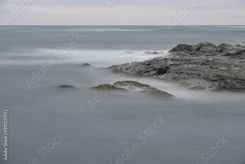 Ocean Waves Over Rocks at Cliff Walk in Rhode Island