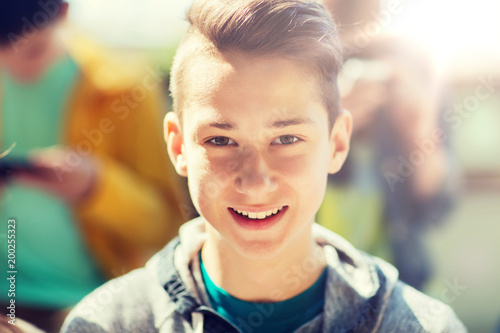 people and portrait concept - happy teenage boy face