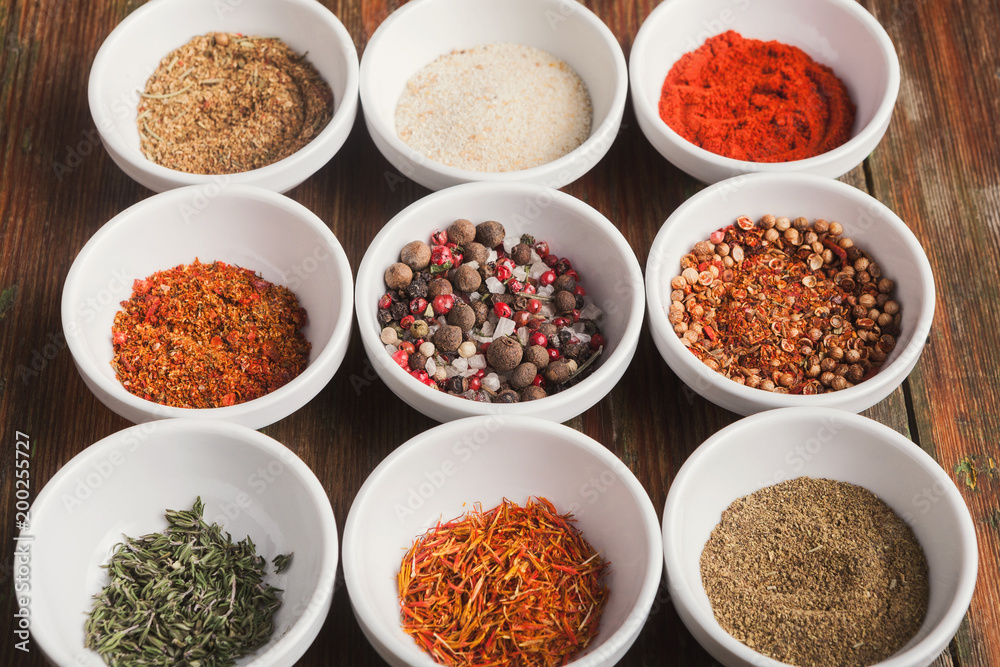 Diverse spices in small cups