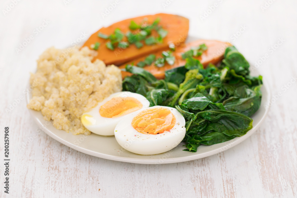 sweet potato with quinoa, boiled egg in dish sweet potato with quinoa, boiled egg in dish