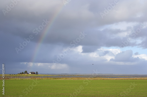 Thunderstorm with rainbow on the island "Amrum", Northern Germany.