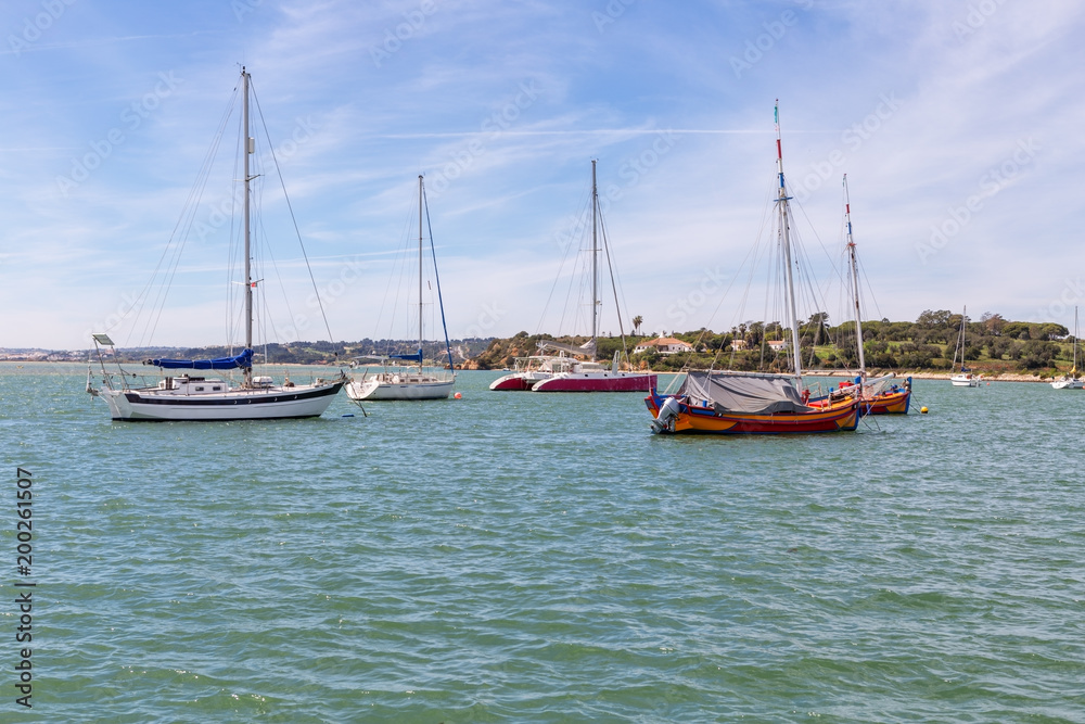 Yachts ships in the bay of the river Alvor.