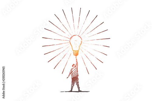 Hand drawn man touching big bright light bulb