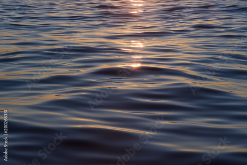 Sunrise reflected on sea waves, Benidorm, Costa Blanca, Alicante province, Spain