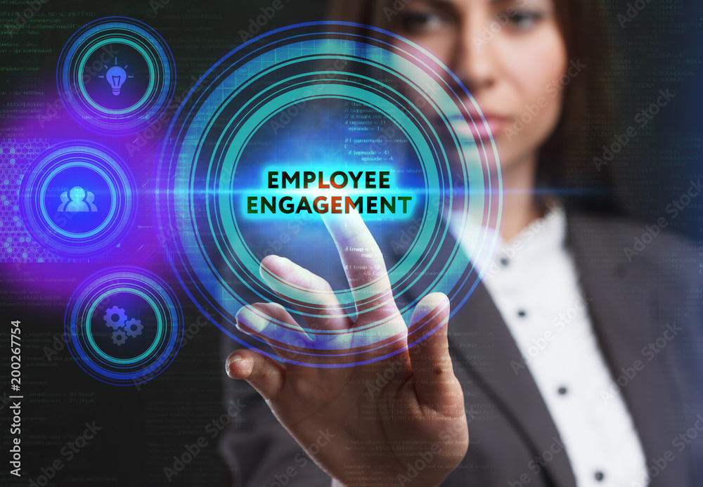 The concept of business, technology, the Internet and the network. A young entrepreneur working on a virtual screen of the future and sees the inscription: Employee engagement The concept of business, technology, the Internet and the network. A young entrepreneur working on a virtual screen of the future and sees the inscription: Employee engagement