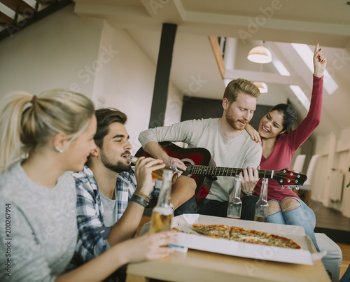 Friends having fun with guitar