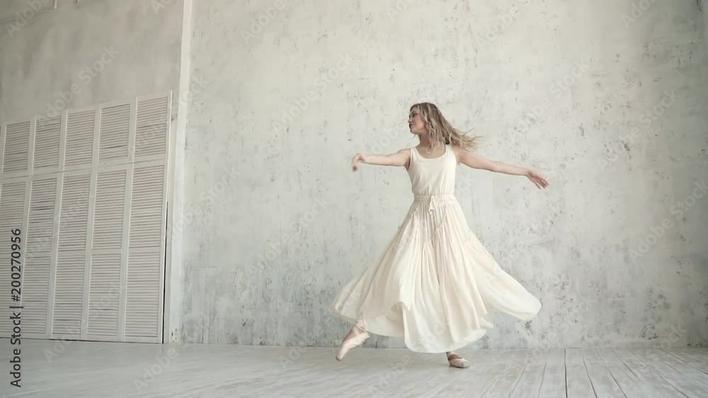 elegant young ballerina dancing ballet in a light dress and Pointe. beauty and grace of youth. slow motion elegant young ballerina dancing ballet in a light dress and Pointe. beauty and grace of youth. slow motion