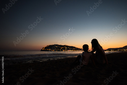 mother and son on the pier ...