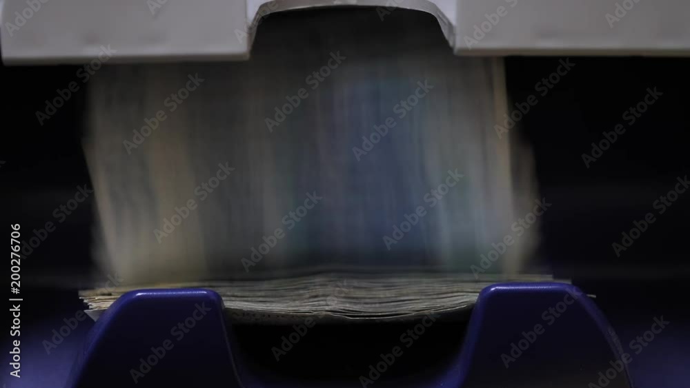 Polish Zloty notes counted in a counting machine Polish Zloty notes counted in a counting machine