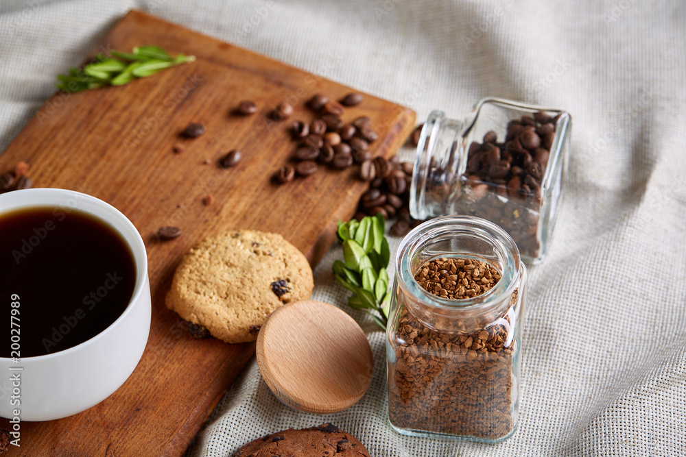 Breakfast background with mug of fresh coffee, homemade oatmeal cookies, grind coffee Breakfast background with mug of fresh coffee, homemade oatmeal cookies, grind coffee