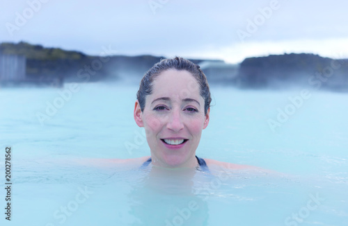 Woman in a hot spring enjoying the warmth © Steve