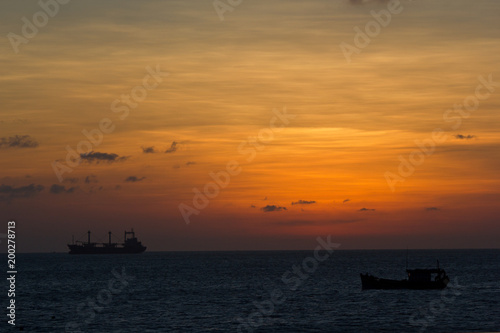 Sunset over the sea and a big ship © Gregory
