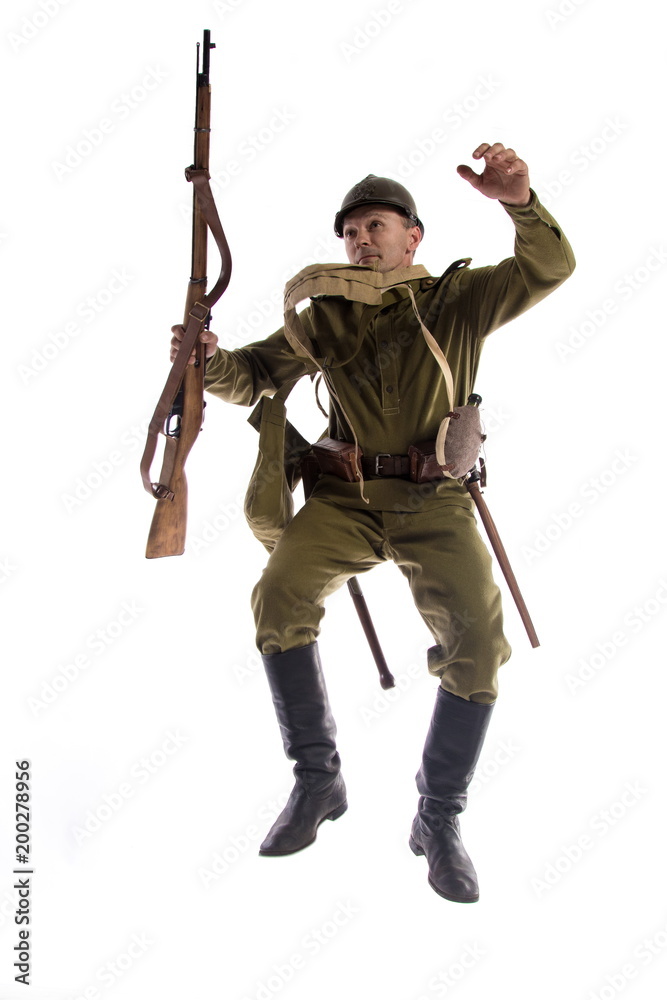 Male actor in uniform and helmet ordinary soldier of Russian army during  World War I posing, jumping and running on white background in studio foto  de Stock | Adobe Stock