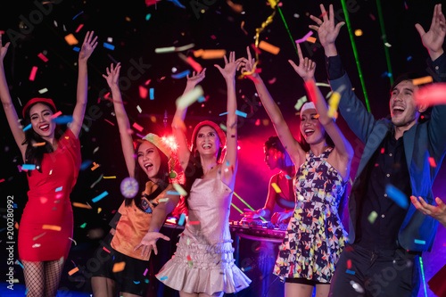 Teenagers are celebrating at the night party.