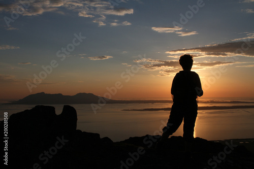 Woman Silhouette in sunset from Mo mountain  Northern Norway
