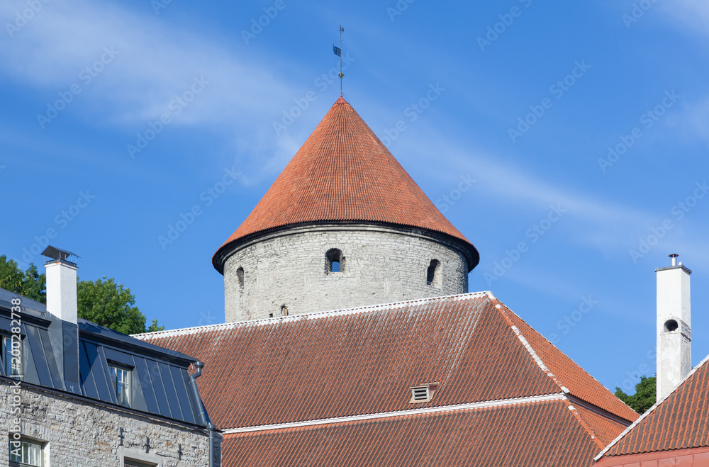 View from the city to the tiled roofs and Bastion Kiek in de Kok is an artillery tower in Tallinn, built in 1475 View from the city to the tiled roofs and Bastion Kiek in de Kok is an artillery tower in Tallinn, built in 1475