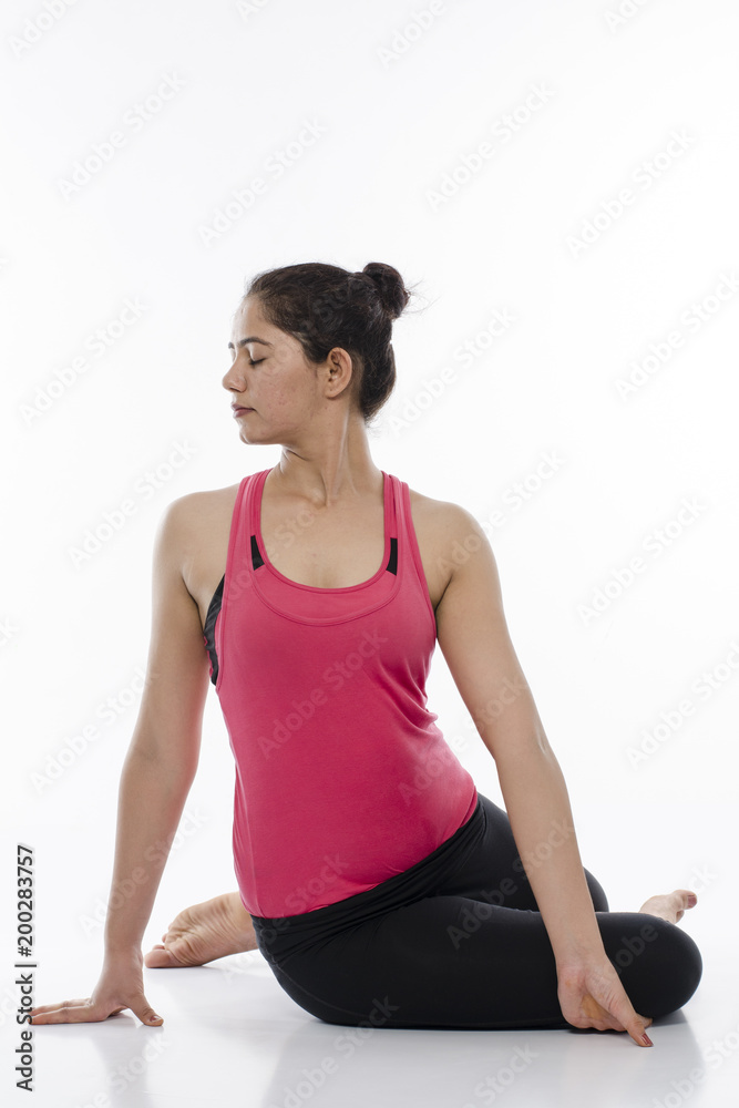 Young woman doing yoga, India Young woman doing yoga, India