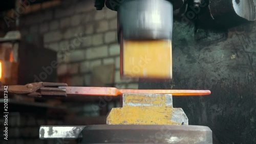 Wallpaper Mural Molten metal is processed under pressure in the hands of a blacksmith Torontodigital.ca