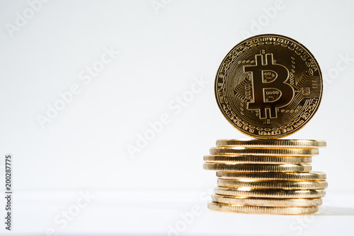 New virtual money Golden bitcoin coin on a white. Cryptocurrency. Business and Trading concept.