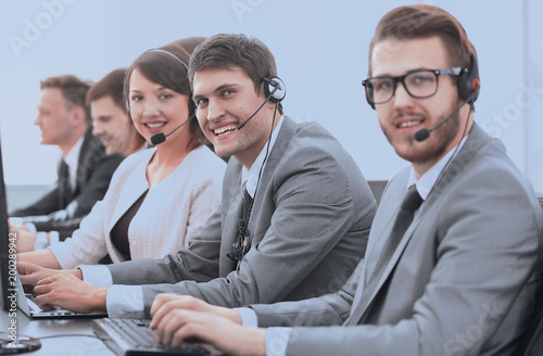 customer service representative with headset in call center