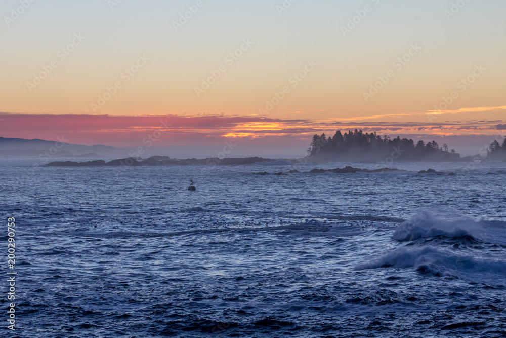 Lighthouse Colorful pre-dawn skies, ocean and a buoy, Ucluelet, Canada. Lighthouse Colorful pre-dawn skies, ocean and a buoy, Ucluelet, Canada.