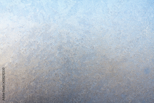 Frost on window glass close up abstract background photo texture