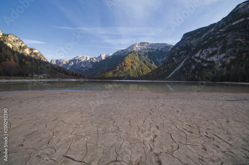 Alpine Lake Landro (lago di Landro) - dry lake with cracks in Italian Dolomites, Italy photo