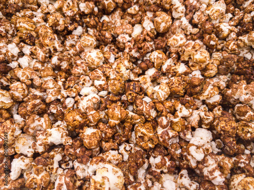 Scattered salted popcorn, texture background.