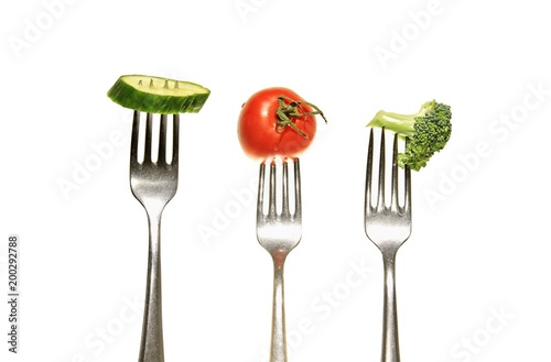cucumber tomato with fork © herlanzer