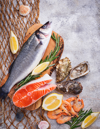 Seafood concept. Fish, shrimps and oysters. photo