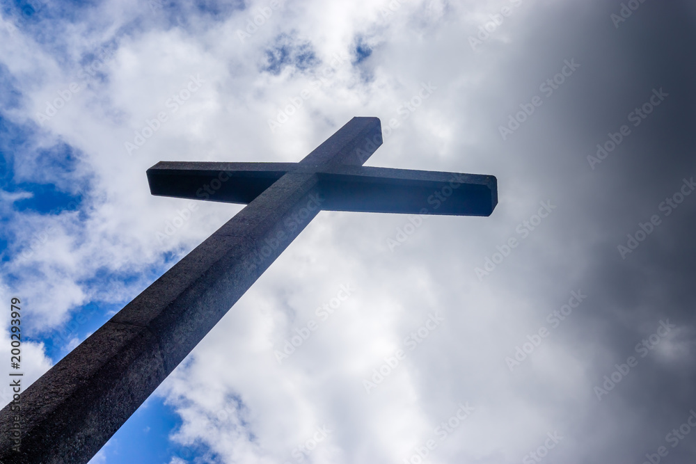 The Cross with clouds in the background.