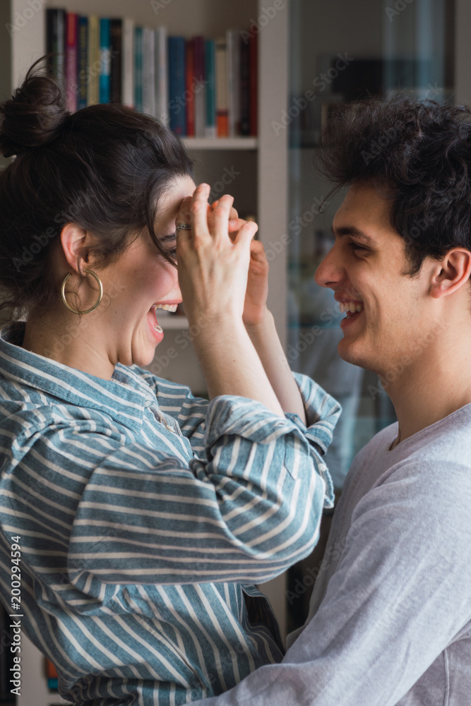Couple embracing at home Couple embracing at home