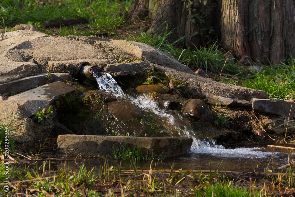 A Small Waterfall in a Quiet Park A Small Waterfall in a Quiet Park