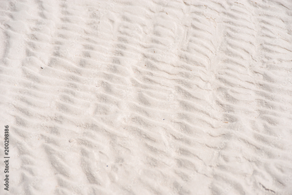 Obraz premium White sand beach background texture