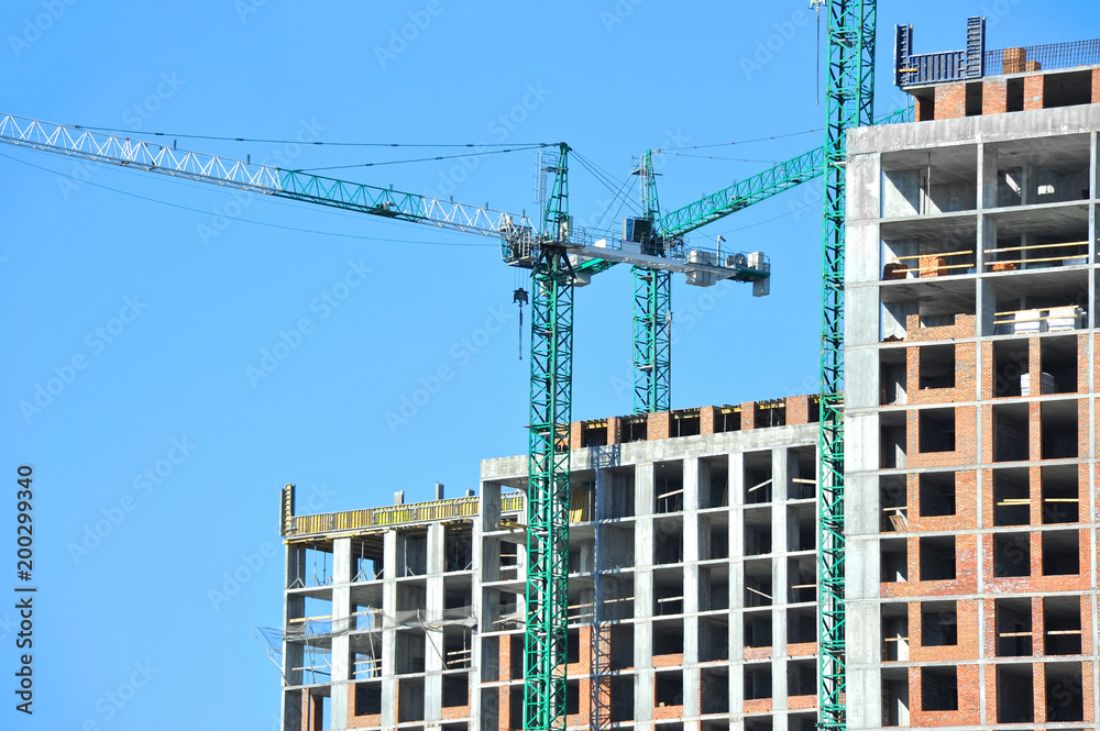 Crane and highrise construction site Crane and highrise construction site