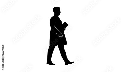  the silhouette of a male doctor is walking at work