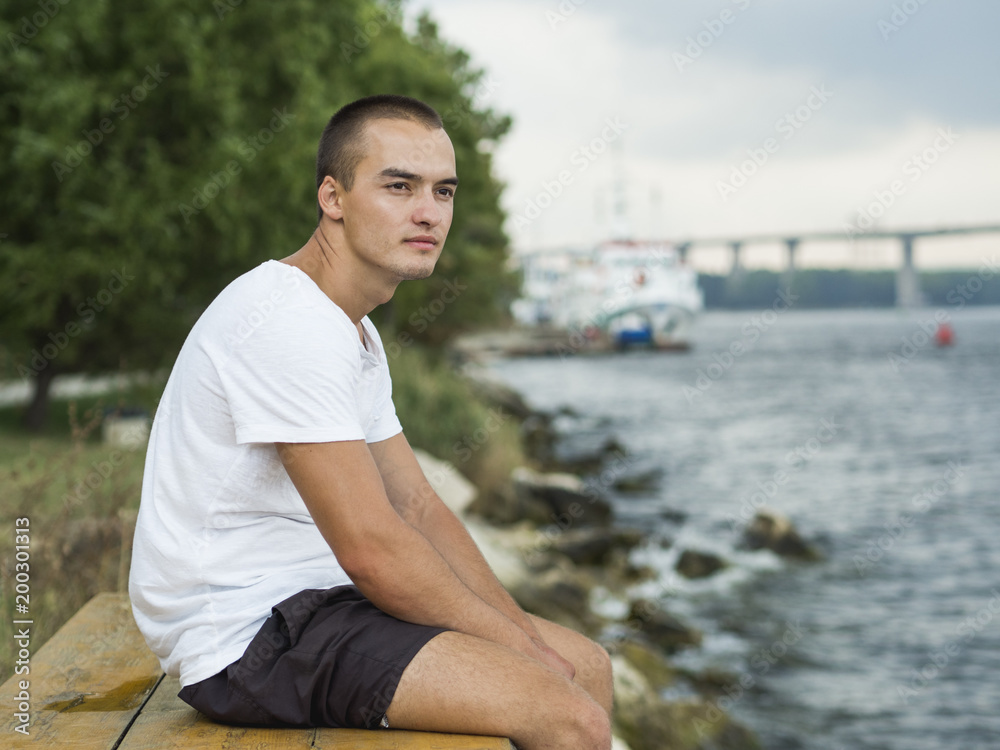 Portrait of a young athtletic man outdoors