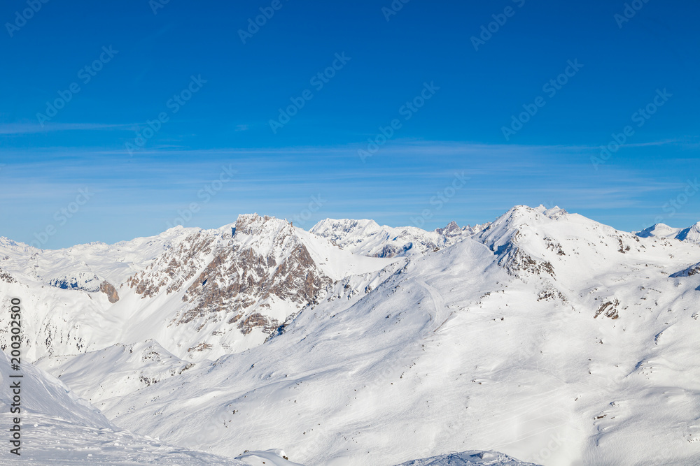 Winter panorama of snowy mountain ridge in 3 Valleys skiing, snowboard resort, Alps, France