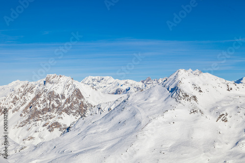 Winter panorama of snowy mountain ridge in 3 Valleys skiing, snowboard resort, Alps, France