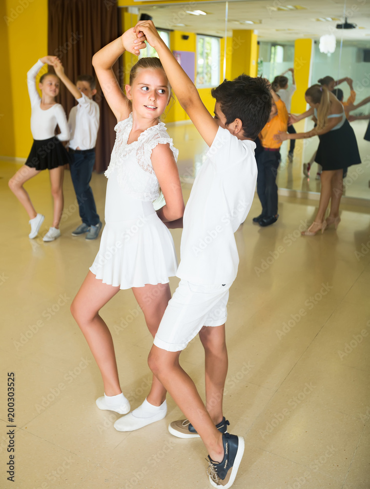 Children  dancing pair dance in class