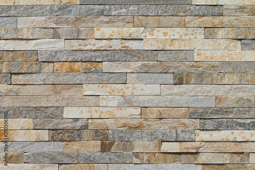 Natural shale. A sample of the wall covering with natural stone. Background.