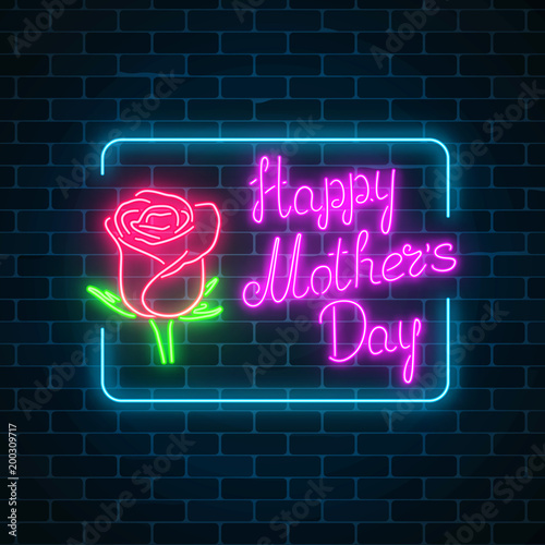 Glowing neon banner of world mothers day on dark brick wall background. Spring greeting card